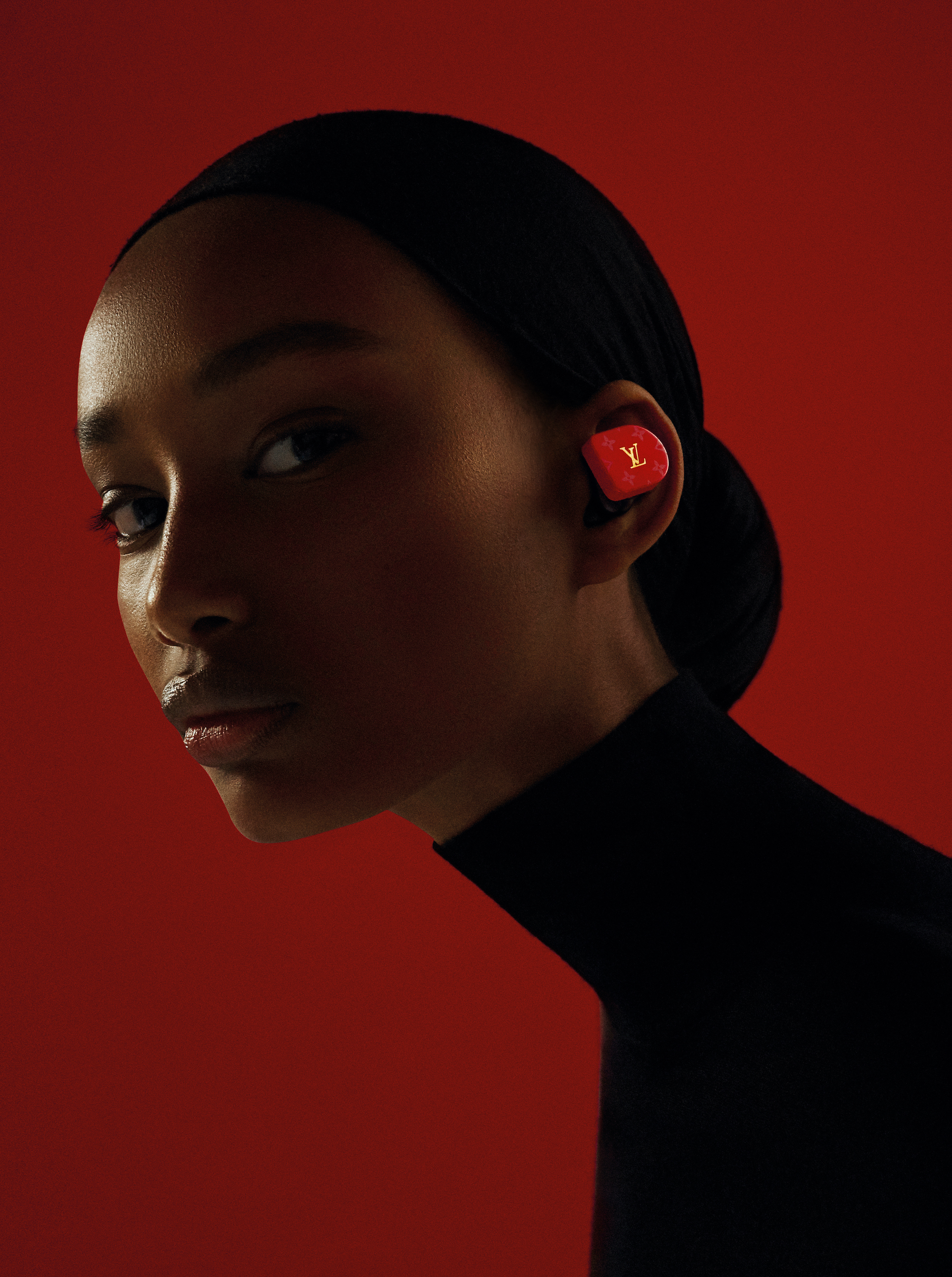  When they took off earlier this year, Louis Vuitton's first wireless earphone buds dropped the mic on today's cordless craze. Even in the vertiginous tech cycle, this elegant range of in-ear styles, from gold-on-white to red hot, pries screen-addicted gazes upward. Seen here on the season's most captivating new face, Ugbad, the earphones have been met with a chorus of fanfare thanks to their sleek color codes, everlasting battery life and aspirational price point. These antidotes to Apple-induced sameness are the forbidden fruit of the future. Louis Vuitton Horizon Red Monogram earphones ($995, available at select Louis Vuitton stores).