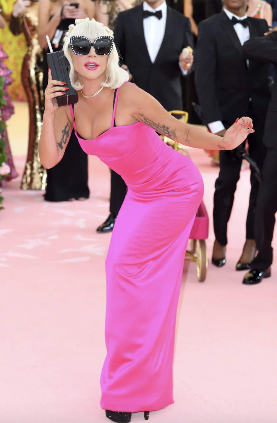  Lady Gaga in one of her CAMP, pink outfit changes on the red carpet at the 2019 Met Gala where she was the host. (Credit: Getty Images).