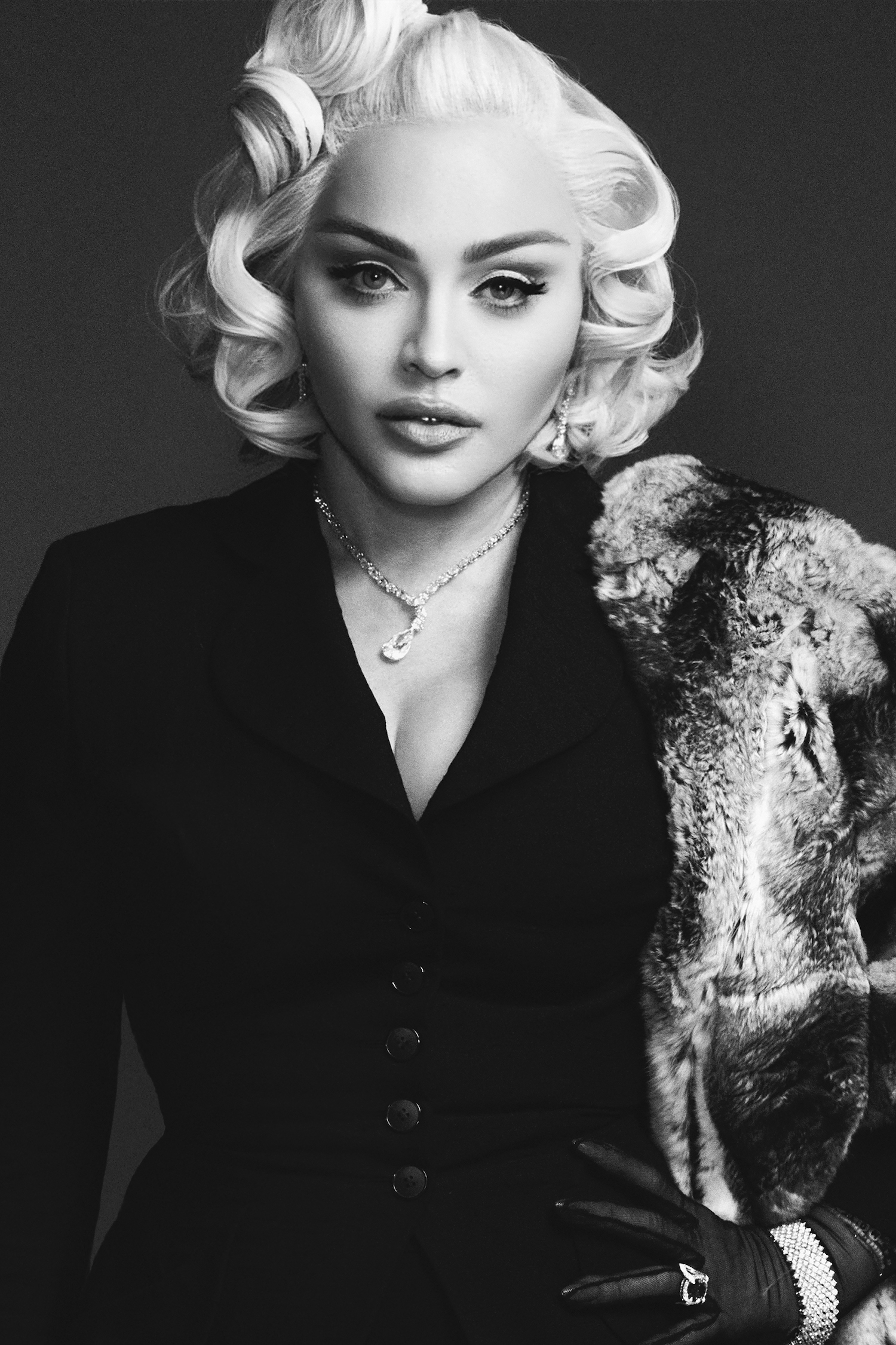  Madonna wears earrings, necklace, bracelet, rings Bucherer Fine Jewellery, Suit jacket and stole, vintage from The Paper Bag Princess Gloves Dita Von Teese for Gaspar // On eyes: Chanel OMBRE PREMIÈRE LAQUE Longwear Liquid Eyeshadow