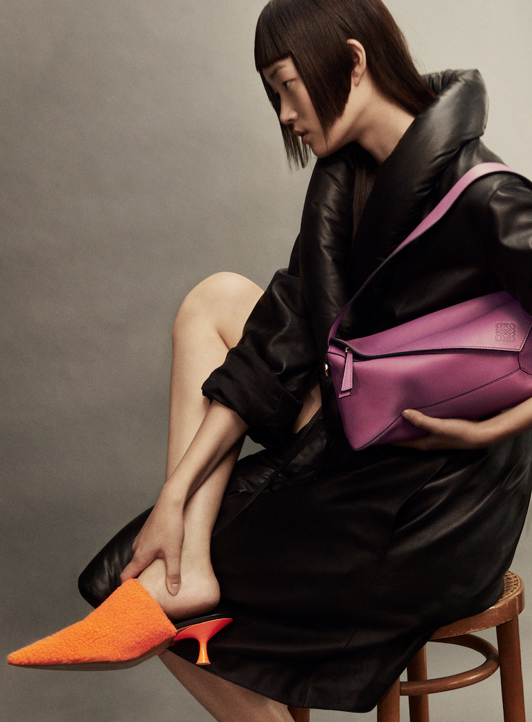  Hyunji holds Puzzle Hobo bag in bright purple, nappa calfskin