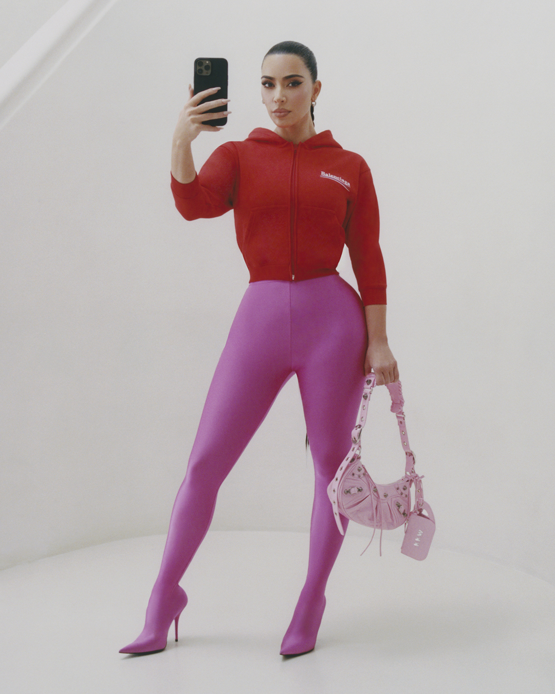  Kim Kardashian, dropped April 10, wearing a cropped Balenciaga hoodie and the Le Cagole Bag