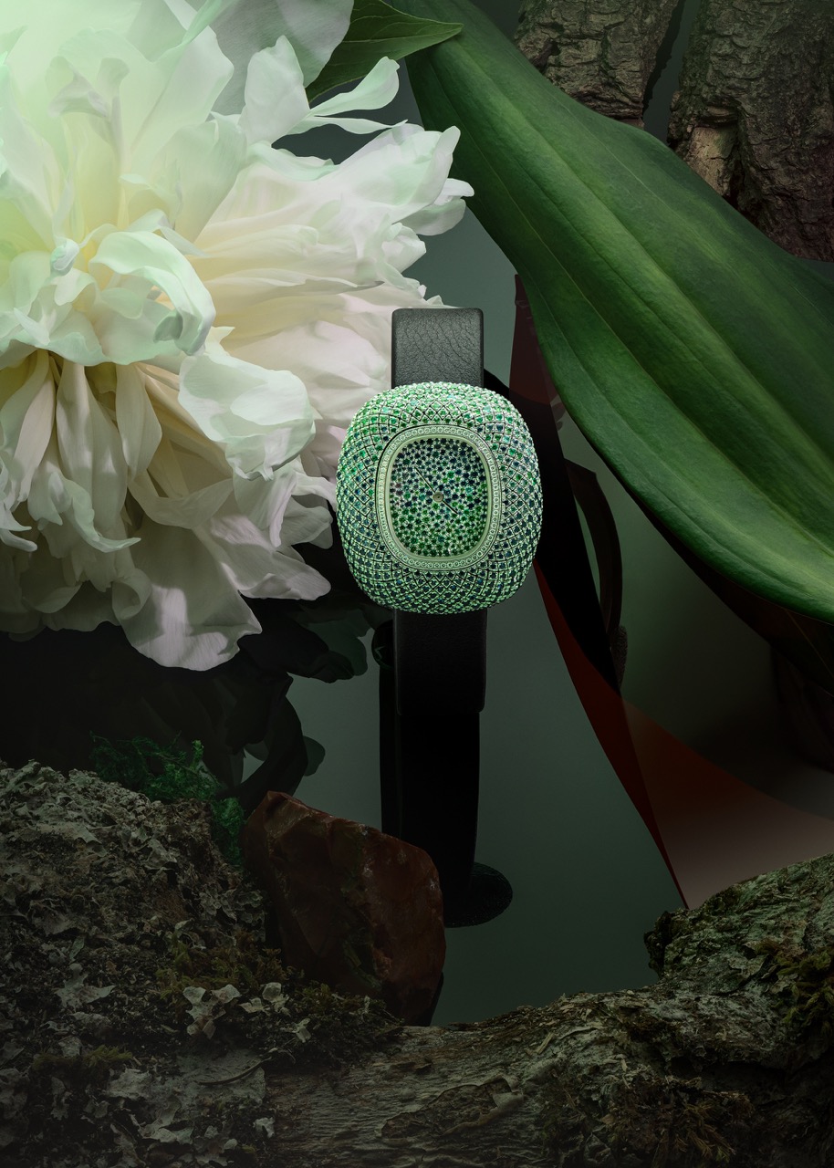  Coussin de Cartier watch (in white gold, diamonds, sapphires, emeralds, tsavorites, and blue tourmalines) (Price upon request, available at select Cartier boutiques nationwide.)