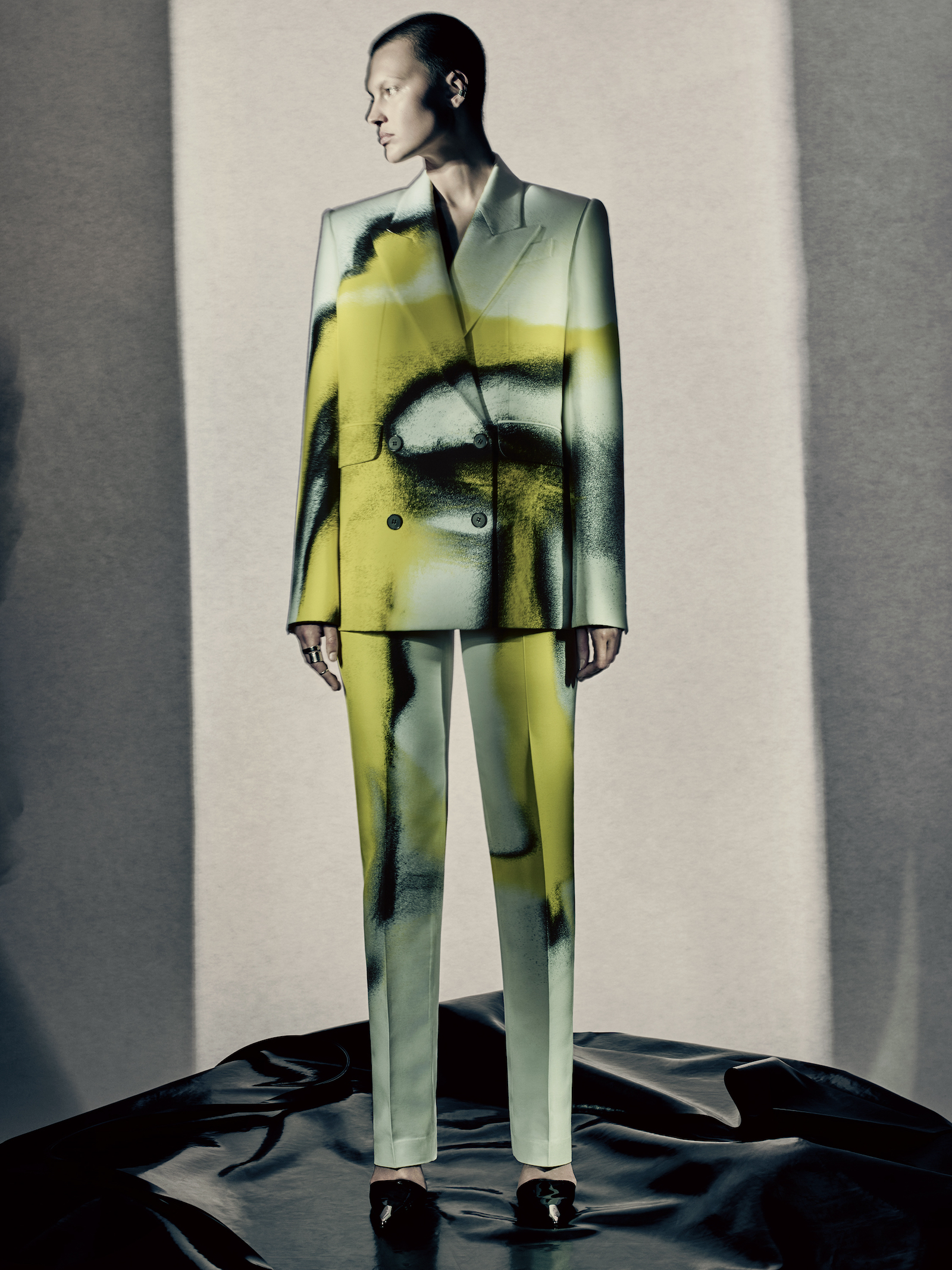 Celina wears bright yellow and black spore print double-breasted tailored jacket and cigarette trousers, photographed by Paolo Roversi.